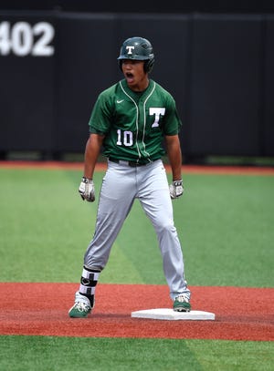 Trinity’s Daylen Lile celebrates after hitting a double during their 7th region semifinal game against Male at Jim Patterson Stadium. May 27, 2019