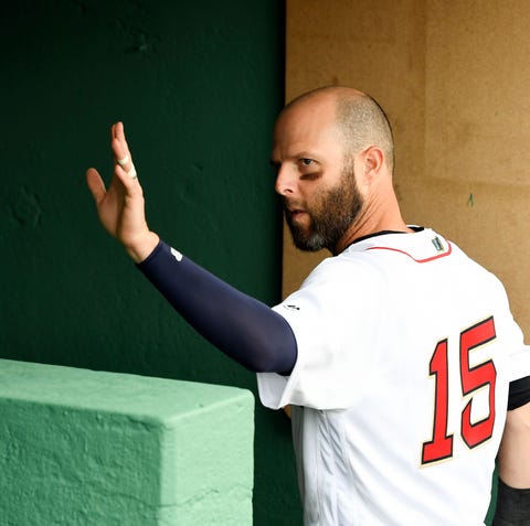 Pedroia waves to fans on April 9 at Fenway Park.