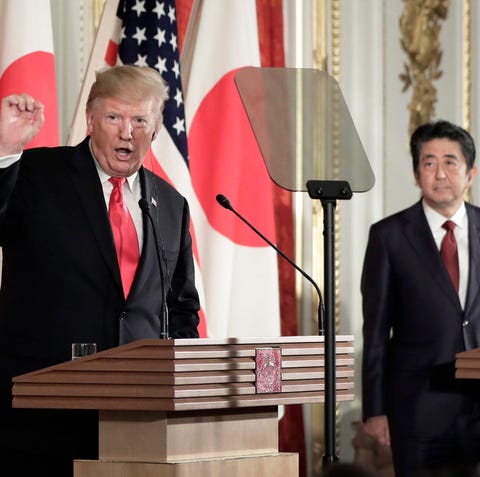 President Donald Trump speaks as Shinzo Abe,...