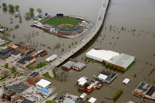 In this Friday, May 3, 2019, aerial file photo, flood waters from the Mississippi River surround Modern Woodmen Park in Davenport, Iowa. Officials in Davenport say the city's public works department has spent over $1 million on flood-fighting efforts and that figure will surely rise as more costs are added in preparation for the potential of future flooding.