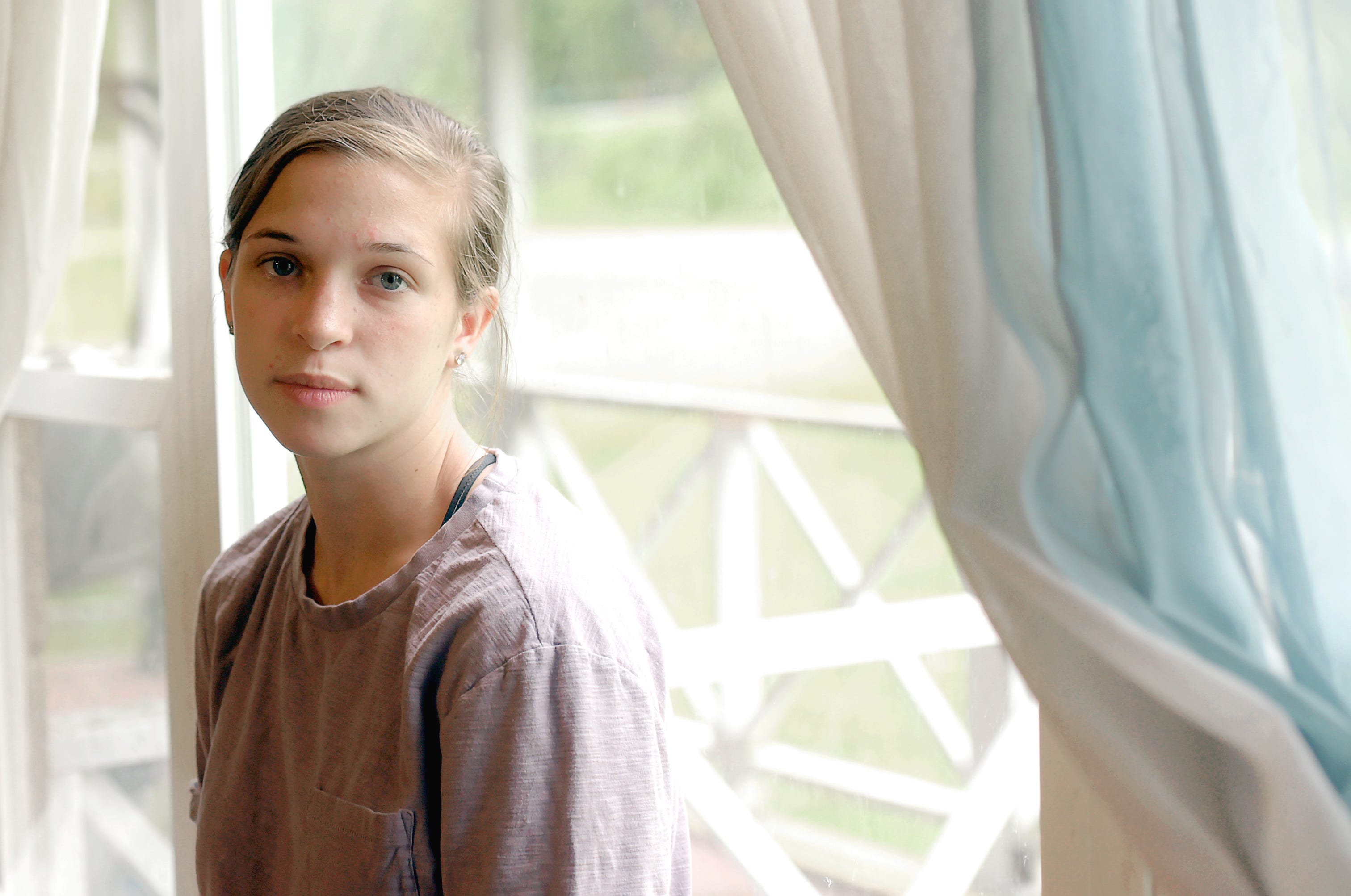 Emily Brown in her family's East Branch home on Tuesday, May 28, 2019. Both Emily and her older sister were diagnosed with cystic fibrosis when they still toddlers.