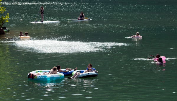 Swimmers and paddleboarders enjoy Mead's Quarry...