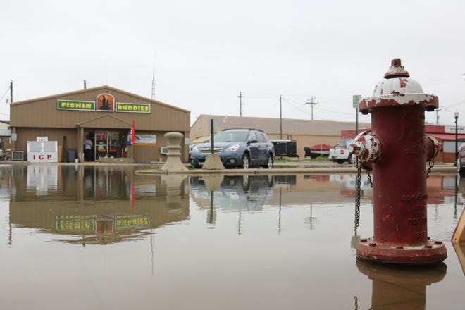 Winds coming out of the northeast once again brought Lake Erie's record-high waters up to the doorstep of local businesses on Madison Street in downtown Port Clinton on Wednesday.