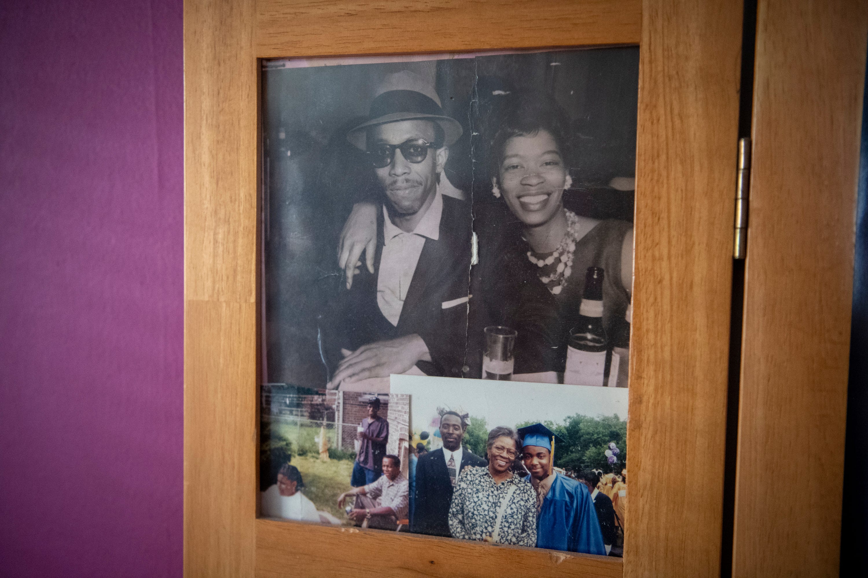 Photos of Charles and Osie Frazier sit on display in a screen in the Frazier family home. 