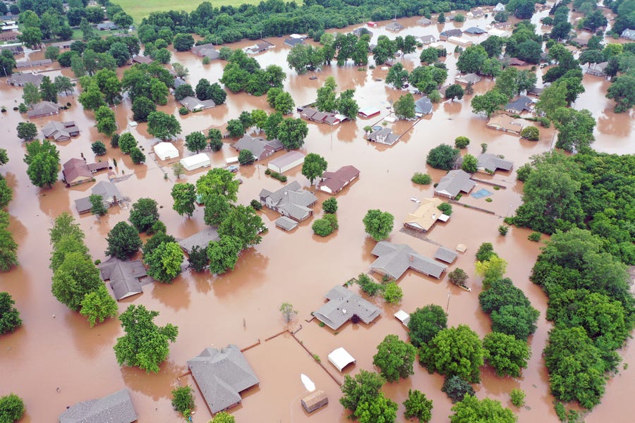 Communities along the Arkansas River, such as Sand Spring, Okla., are getting flooded.