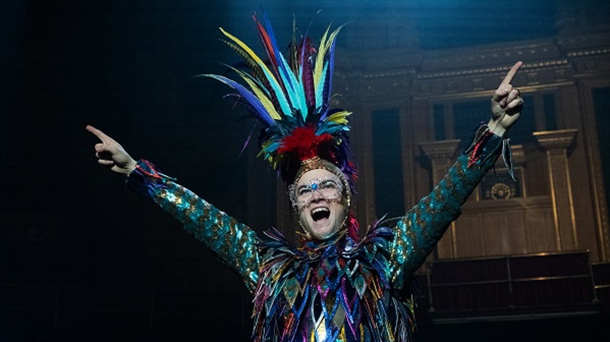Taron Egerton crows as Elton John in "Rocketman."