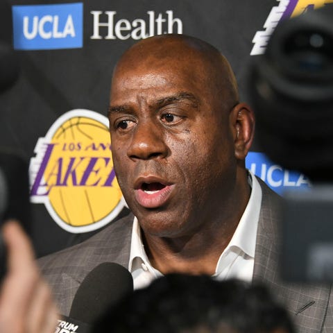 Magic Johnson abruptly resigned as the Los...
