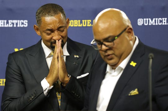 New University of Michigan basketball head coach, Juwan Howard, gets excited as sports director, Warde Manual, presents him at a press conference on Thursday, May 30, 2019 at Crisler Center in Ann Arbor, Michigan.