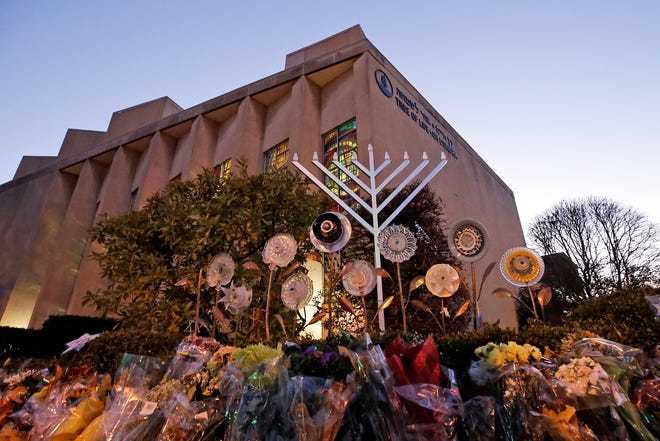 In this Sunday, Dec. 2, 2018 file photo, a menorah is installed outside the Tree of Life Synagogue in preparation for a celebration service at sundown on the first night of Hanukkah, in the Squirrel Hill neighborhood of Pittsburgh.