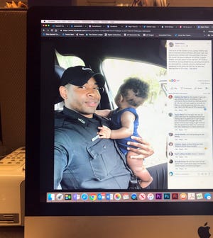 This photo of a computer screen shows a photo of James Hollins in a Facebook post.