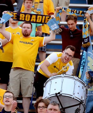 Some Nashville SC fans hold up their scarves during the anthem before the start of the U.S. Open Cup between Nashville SC and  Charleston Battery on Wednesday, May 29, 2019, at the Dean A. Hayes Track and Soccer Stadium at MTSU. 