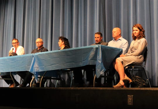 Bloomfield City Attorney Ryan Lane speaks while on stage with City Councilor Curtis Lynch, Mayor Cynthia Atencio, consultant Edwin Reyes, Guzman Energy Managing Director Jeffrey Heit and Guzman Energy attorney Robin Lunt during a meeting on May 29, 2019 at Bloomfield High School.