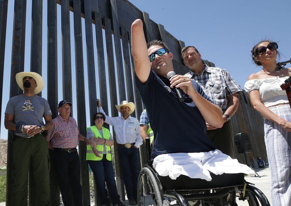 Brian Kolfage, Founder of We Build the Wall, speaks at a press conference Thursday at the site of the civilian-built wall in Sunland Park, New Mexico. Construction of the citizen-funded bollard fence continued Thursday after Sunland Park, New Mexico lifted their cease and desist order. 