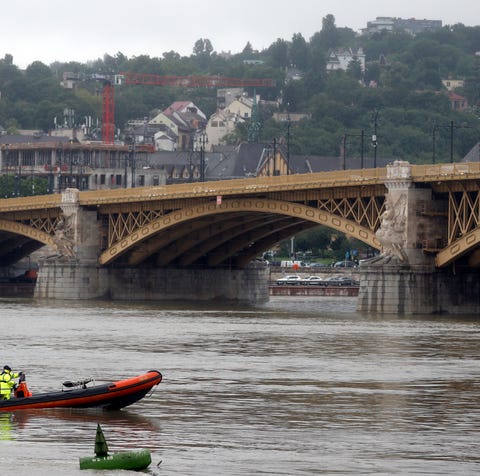 A rescue boat searches for survivors on the River 