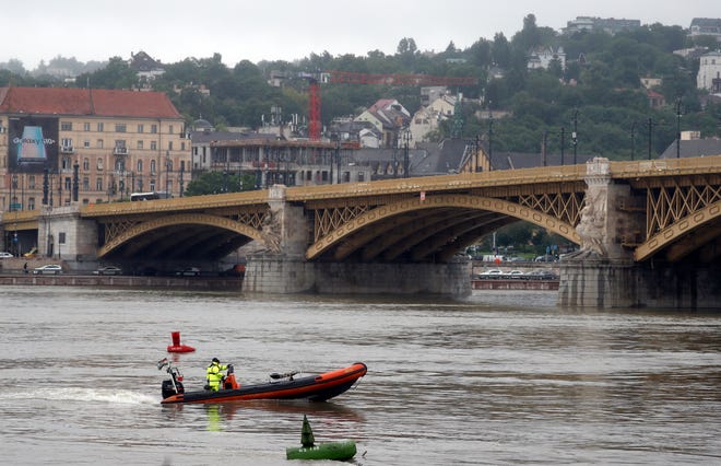 A rescue boat searches for survivors on the River Danube in Budapest, Hungary, Thursday, May 30, 2019. A massive search was underway on the river for missing people after the sightseeing boat with South Korean tourists sank after colliding with another vessel during an evening downpour.