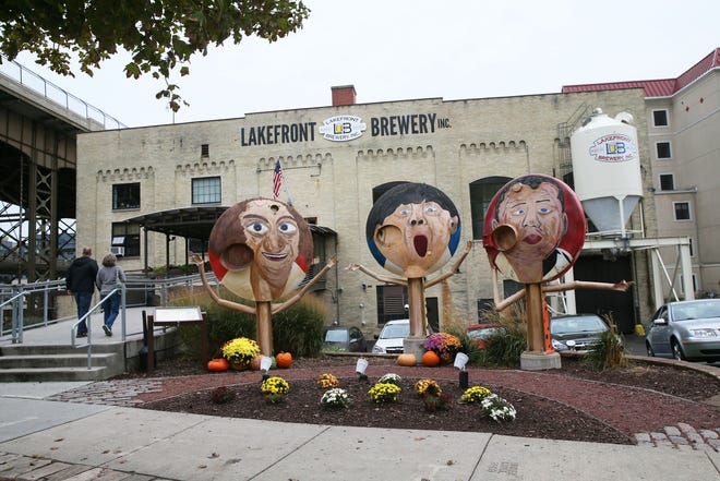 The Three Stooges, painted on the ends of old fermentation tanks, welcome visitors to Lakefront Brewery in Milwaukee.
