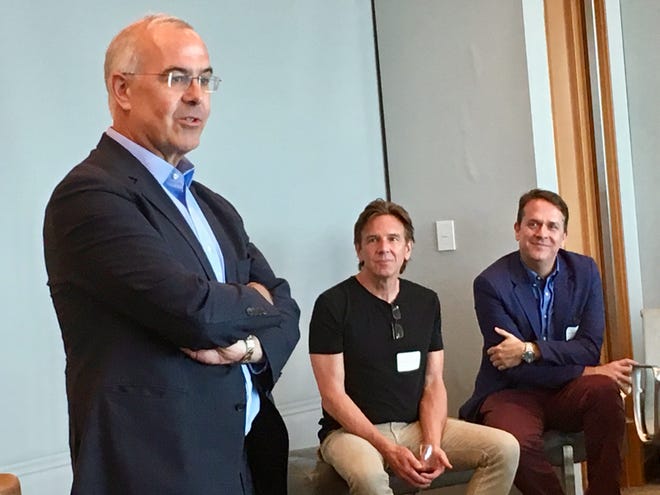 The New York Times columnist David Brooks speaks to about 40 Nashville community leaders May 30, 2019, as noted music producer Dann Huff, center, and Rondal Richardson of the Community Foundation of Middle Tennessee look on.
