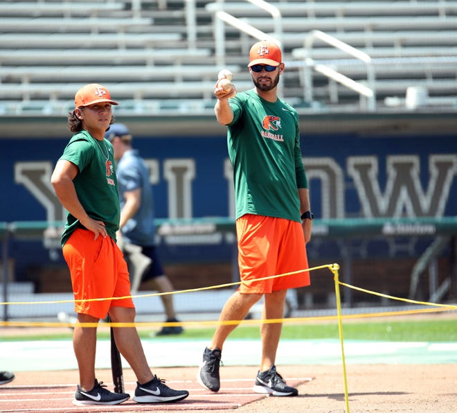 FAMU pitching coach Bryan Henry (right) and volunteer assistant Alec Wong look over the action during practice at Georgia Tech on Wednesday, May 30, 2019.
