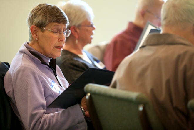 In a Tuesday, May 21, 2019 photo, Marilyn Dansart, of Dubuque, sings during a rehearsal for Healing Harmonies Chorus at Arbor Oaks Bible Chapel in Dubuque, Iowa. (Jessica Reilly/Telegraph Herald via AP)