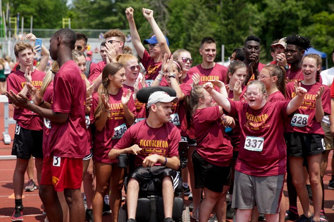 The McCutcheon Unified Track & Field team reacts after placing fourth in the State Finals, Saturday, June 1, 2019, at Indiana University's Robert C. Haugh Track & Field Complex in Bloomington.