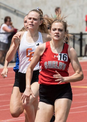 Shelby’s Makenna Heimlich competes in the 800 meter run en route to a third place medal in the state track meet.