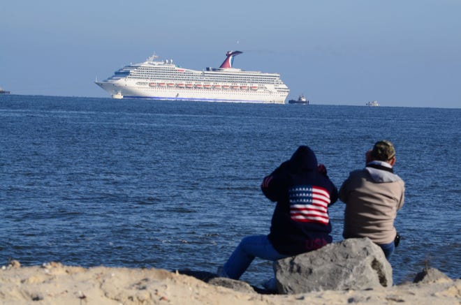 The Carnival cruise liner Triumph is seen from Dauphin Island, Alabama in this February 14, 2013, file photo. Carnival Corp. is in Miami federal court for a hearing on what to do about allegations that it has continued polluting the oceans from some of its cruise ships despite agreeing years ago to stop.