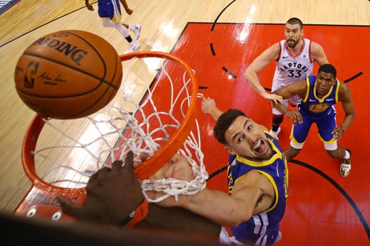 Game 2: Golden State Warriors guard Klay Thompson goes for a rebound.