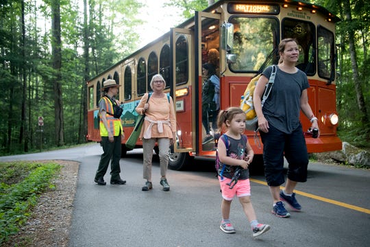 Visitors unload from trolleys and find a space along trails at the Elkmont Campground in the Great Smoky Mountains National Park to view the synchronous fireflies on June 3, 2019. Between 980 and 1100 come to the campground to watch the phenomenon each night of the 8-day mating period. 