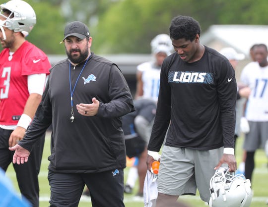 Lions coach Matt Patricia talks with halfback Kerryon Johnson after the minicamp on Tuesday, June 4, 2019 at Allen Park.