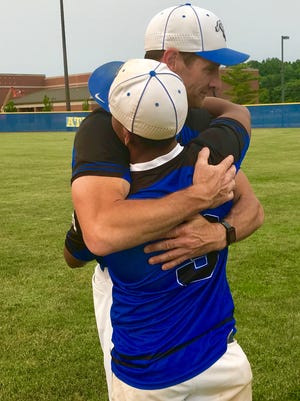 Frankfort baseball coach Andy Dudley embraces senior third baseman Jose Valdes Sandoval after the Hot Dogs fell 2-1 to second-ranked Edgewood in the Class 3A regional at Crawfordsville.