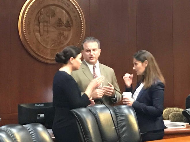 Attorney General Ashley Moody, CFO Jimmy Patronis and Agriculture Secretary Nikki Fried (From left to right) have a brief discussion before start of Tuesday's cabinet meeting on Florida territory.