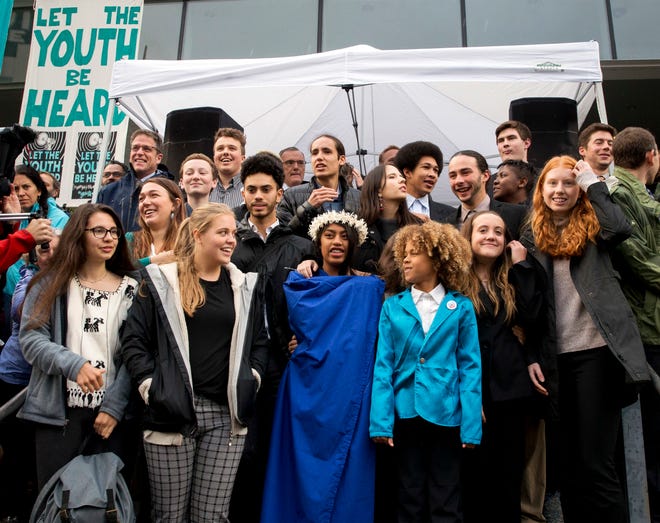 Young plaintiffs stand on the steps of the United States District Courthouse during a rally in Eugene, Ore., to support a high-profile climate change lawsuit against the federal government on Oct. 29, 2018.
