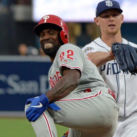 Phillies outfielder Andrew McCutchen grimaces in...