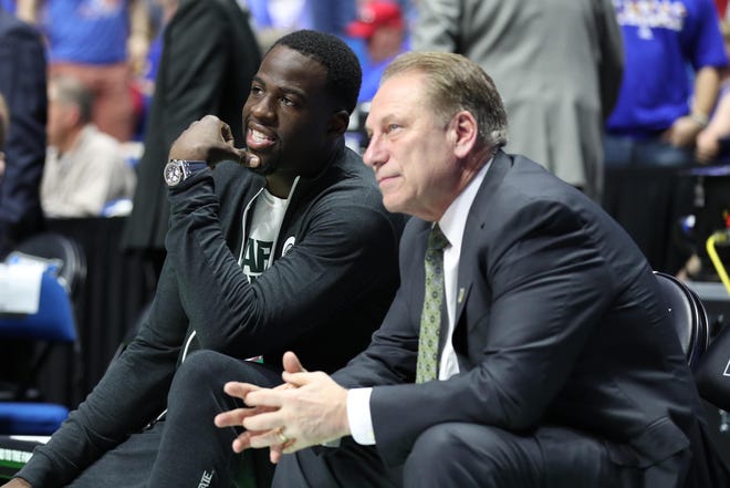 Golden State Warriors strongman Draymond Green speaks to Michigan State Spartans coach Tom Izu before the game between the Kansas Jayhawks and Michigan State Spartans in the second round of the 2017 NCAA Tournament at the BOK Center.