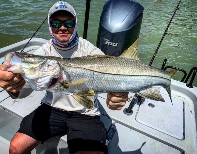 Jerry from New Jersey with a nice snook using a live mullet head.