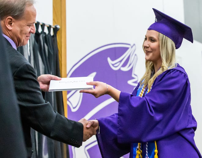 Valedictorian Mikayla Peardon receives her diploma from District Administrator Steven Bloom during the Class of 2019 Commencement Ceremony at Palmyra-Eagle High School on Sunday, June 2. Tentative hearing dates have been scheduled to discuss the proposed dissolution of the school district.