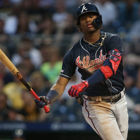 Braves centerfielder Ronald Acuna Jr. reacts to...