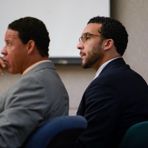 Kellen Winslow,  flanked by two of his three...