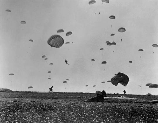 Paratroopers of the Allied Army land on La Manche, on the coast of France on June 6, 1944, after Allied forces stormed the Normandy beaches during D-Day.