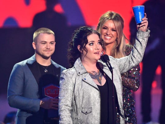 Ashley McBryde celebrates her victory for the breakthrough video of the year presented by Hunter Hayes and Carly Pearce at the 2019 CMT Music Awards at Bridgestone Arena on Wednesday, June 5, 2019 in Nashville, Tennessee.
