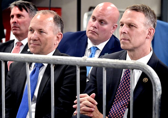 U.S. representatives Lloyd Smucker and Scott Perry, right, listen to Vice President Mike Pence who spoke during an appearance at JLS Automation in Springettsbury Township Thursday, June 6, 2019. Bill Kalina photo                       