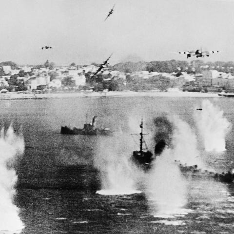 Allied forces' military planes bombing enemy boats