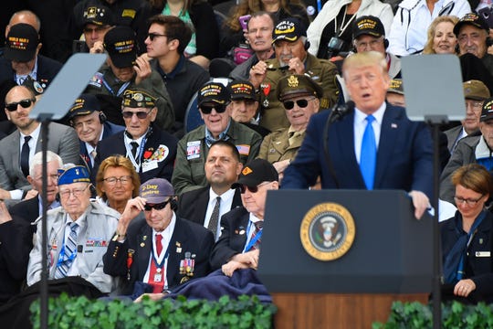 US WWII veterans listen to US President Donald Trump delivering a speech during a French-US ceremony at the Normandy American Cemetery and Memorial in Colleville-sur-Mer, Normandy, northwestern France, on June 6, 2019, as part of D-Day commemorations marking the 75th anniversary of the World War II Allied landings in Normandy. (Photo by Damien MEYER / AFP)