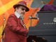 In this April 26, 2008 file photo, Dr. John performs during the 2008 New Orleans Jazz & Heritage Festival in New Orleans. The family of the Louisiana-born musician known as Dr. John says the celebrated singer and piano player who blended black and white musical influence with a hoodoo-infused stage persona and gravelly bayou drawl, has died. He was 77. A family statement released by his publicist says Dr. John, who was born Mac Rebennack, died early Thursday of a heart attack.