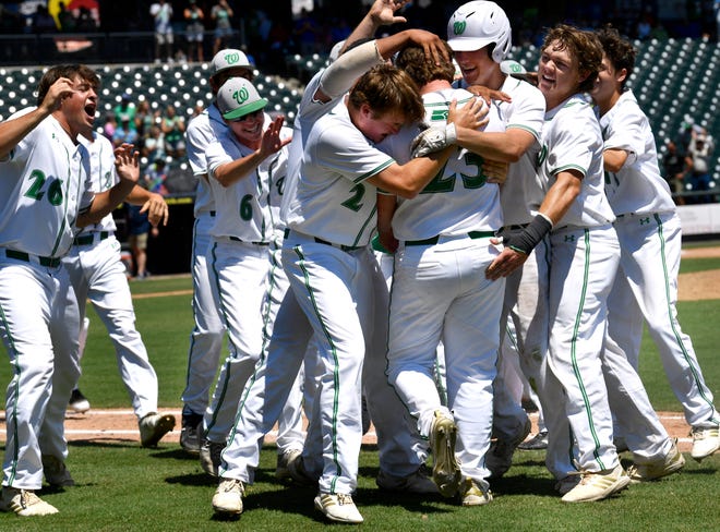 Wall High School players celebrate teammate Gage Weishuhn's game-winning hit which allowed Caleb Heuertz to score the winning run against Kirbyville in Friday's UIL Class 3A state semifinal game June 7, 2019. Wall will play in the state final Saturday at Dell Diamond in Round Rock.
