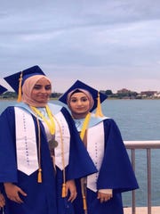 Zainab Altalaqani, 18, left, and Tuhfa Kasem, 17, of Detroit were both named salutatorian at Universal Academy. They used their graduation ceremony speeches to blast their school.