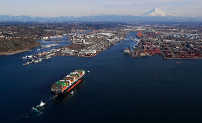 In this March 5, 2019, file photo, a cargo ship arrives at the Port of Tacoma, in Tacoma, Wash. President Donald Trump’s trade wars have already wiped out all but $100 of the average American household’s windfall from Trump’s 2017 tax law.