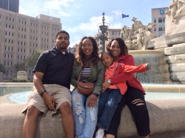 Armon R. Perry, an associate professor at the University of Louisville’s Kent School of Social Work, with his family.