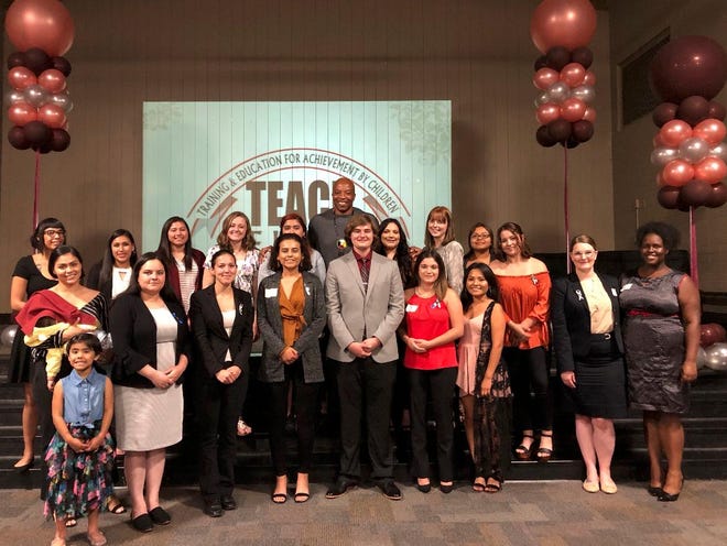 TEACh college scholarship winners pose with well-wishers at a banquet in their honor on Tuesday. The awards go to college students who were in foster care as children.