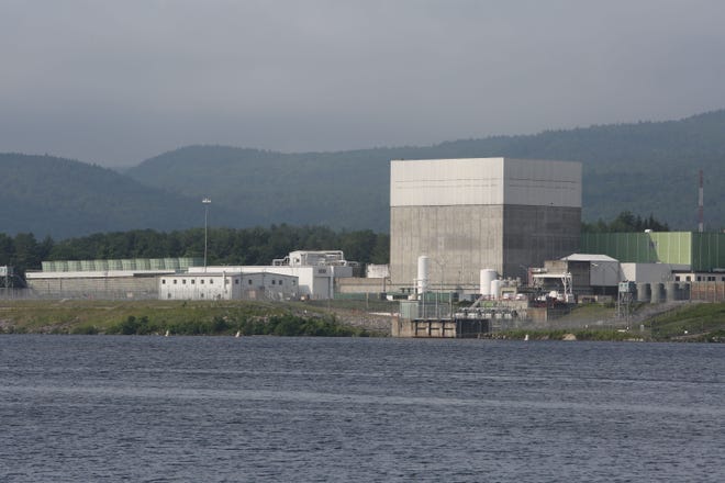 The Vermont Yankee Nuclear Power Plant in Vernon, Vermont, as seen from across the Connecticut River from New Hampshire, June 19, 2017. The large cube is the reactor building.